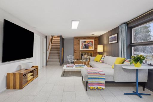 Walkout lower level with heated Terrazzo floors. The lower level also has a sauna and exercise room.