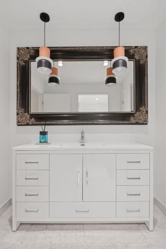 Main floor bathroom with marble counter top