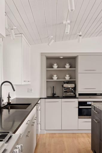 Coffee bar next to the warming drawer and speed oven with convection