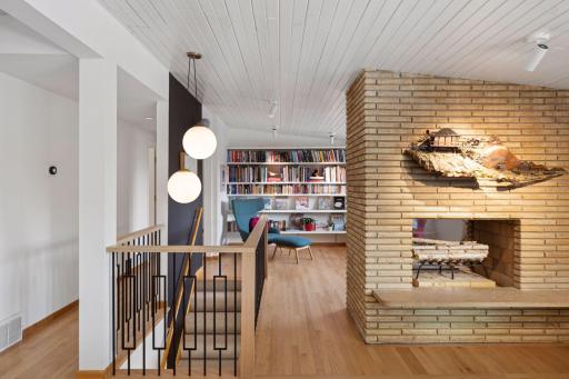Looking into the library with a custom wood and metal railing