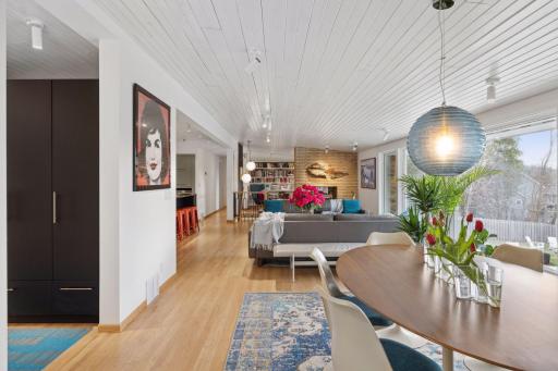 Dining space and living room with refinished flooring throughout
