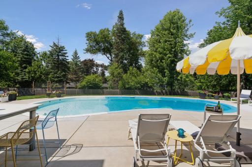 The pool deck offers multiple spaces to hang out in