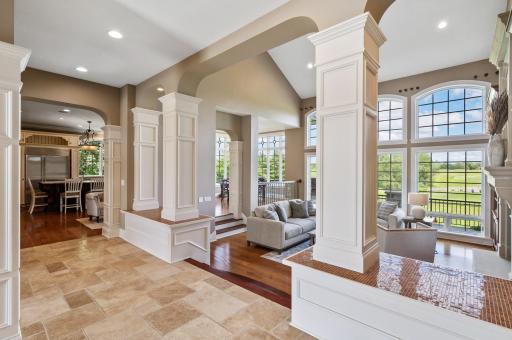 Soaring ceilings and abundant natural light enhance the open and airy living space.
