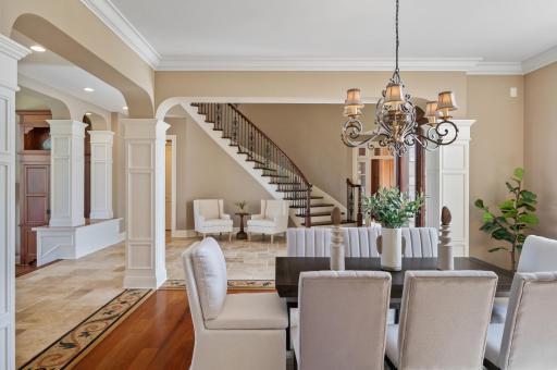 Elegant dining room, with the grand foyer just beyond.