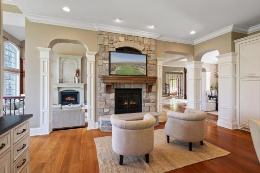 The thoughtful layout of this home includes a comfortable sitting room with stone surround fireplace, conveniently situated off the kitchen.