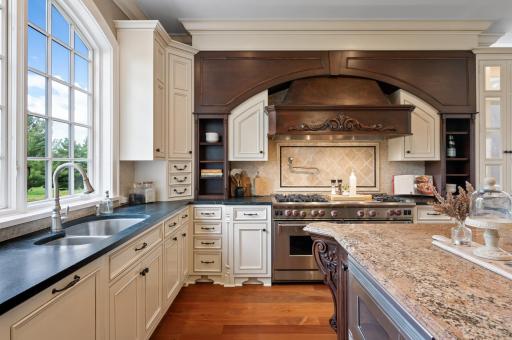 Beautifully appointed kitchen with custom design and impressive Wolf range.