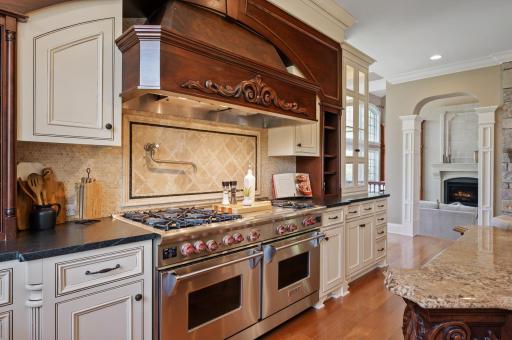 The kitchen and adjacent sitting room create a central hub for living and entertaining.