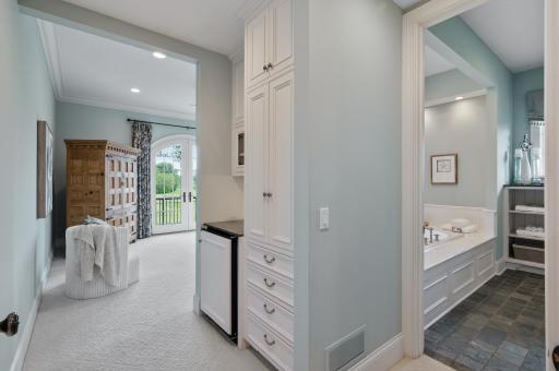 Well-appointed transition area connecting the spacious primary suite and the luxurious ensuite bathroom.