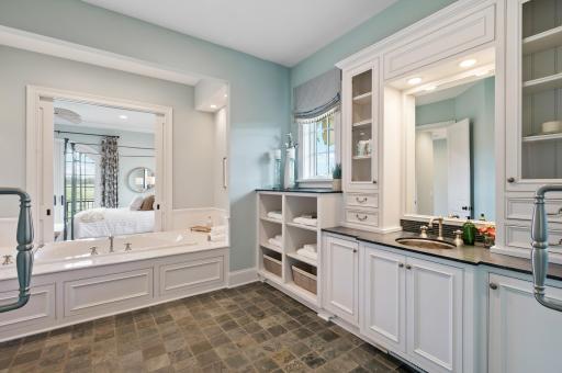From the soaking tub to the dual vanities and easy access to the primary bedroom, this ensuite is designed for ultimate comfort and convenience.