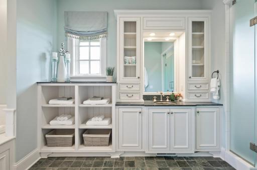 Beautiful and functional vanity area with ample storage and counter space.