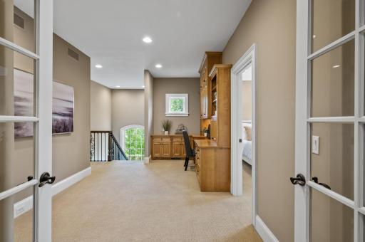 Convenient built-in desk or office nook on the upper level. Perfect for a home office or study space.