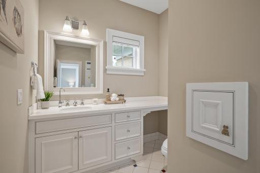 Bright and functional vanity area in this upper level bathroom, offering ample counter space and natural light.