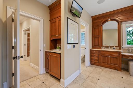Thoughtfully designed for comfort and luxury, this transition area connects the spacious second primary suite to its beautiful bathroom.