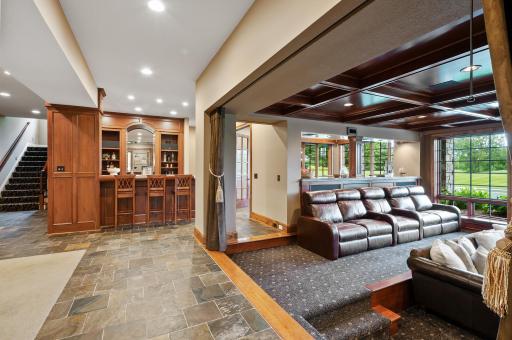 Completing the immersive theater experience are the custom drapes, a thoughtful and significant investment that adds to the room's acoustics and overall sophistication.
