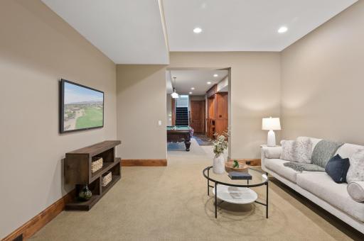 The well-designed layout of the lower level places this comfortable living space within easy reach of the game area.