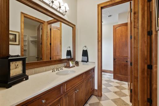 Plenty of countertop space on the vanity in this Jack-and-Jill bathroom connected to the lower level bedroom.