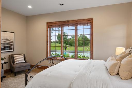 Find tranquility in this lower level bedroom, complete with a view to the surrounding landscape.