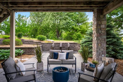 Relax and unwind on this comfortable covered patio, offering a perfect spot to enjoy the outdoors.