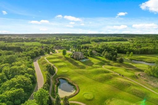 Experience the epitome of luxurious living in this exceptional home offering both privacy and direct access to the golf course.
