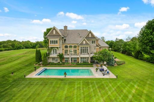 Stunning pool and vast lawn perfect for outdoor recreation.