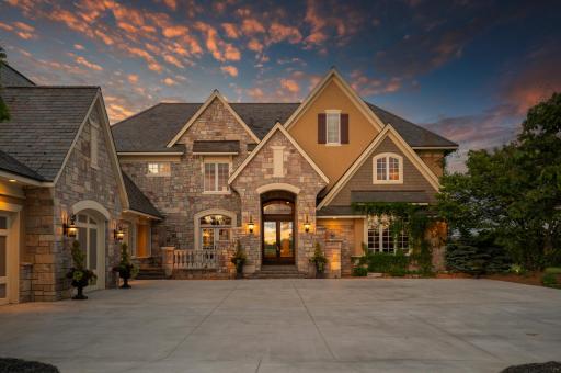 The grand entrance of this estate welcomes you with warmth and elegance.