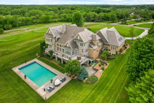 The ultimate setting for outdoor enjoyment with its large pool and sprawling, beautifully maintained grounds.