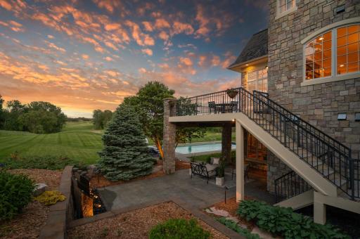 Capture the unique evening perspective from the upper deck and lower patio, offering stunning views of the pool and golf course.