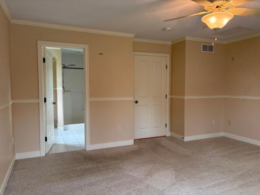 primary bedroom door to private 3/4 bathroom