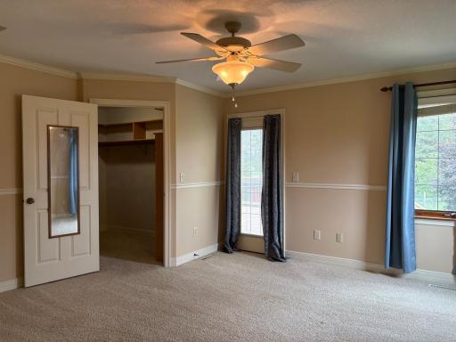 primary bedroom door to closet and to deck