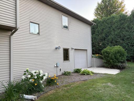back of home w/ garage door to prestressed garage