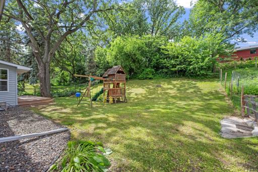 Spacious backyard with room for play-set and great sliding hill