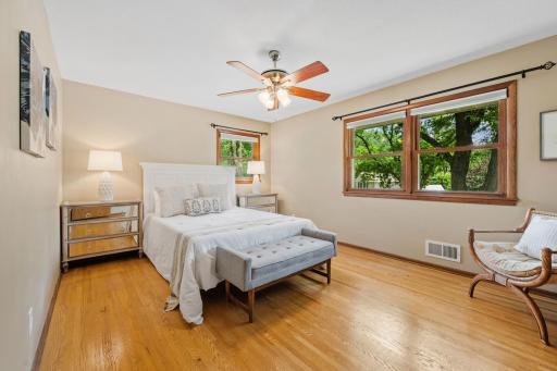 Large primary bedroom with hardwood floors
