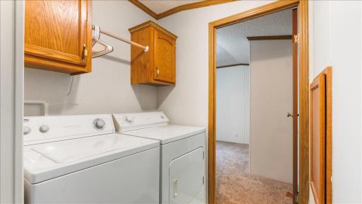 The washer and dryer are conveniently located between the bedrooms.