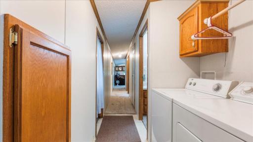 The washer and dryer are conveniently located between the bedrooms.