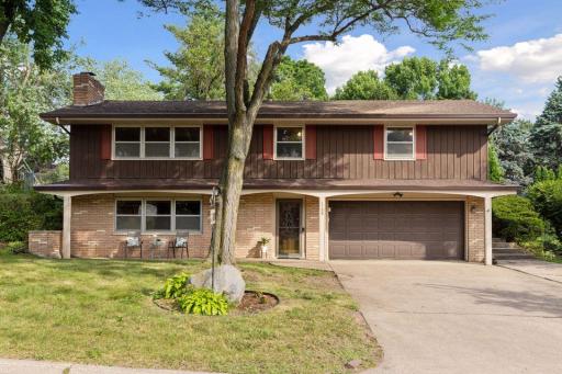Front of home is so inviting it beckons you in to the beauty within. Concrete driveway has a bump out for additional off street parking.