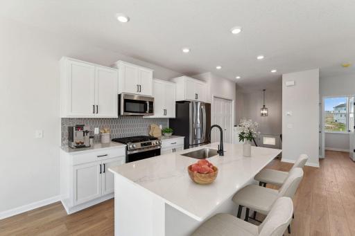 Designer-curated selections in this upgraded kitchen- virtual staging
