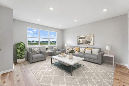 Family room with large windows and southern exposure for great natural light!- virtually staged!