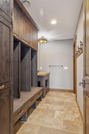 Lower-level lake room 3/4 bath with custom lockers for all of your lake gear and a place for towels and suits to dry.