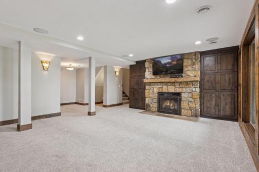Click on the gas fireplace for warmth and ambiance and enjoy custom built-ins flanking the fireplace.