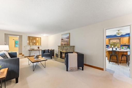 A sizable family room offers front yard views and a great room for hanging out.