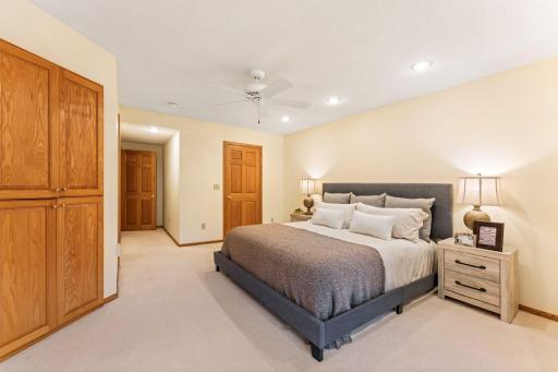A spacious primary bedroom offers built-ins and a walk-in closet.