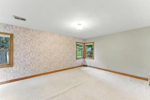 The large second bedroom has corner windows on two sides, a fabulous architectural detail of the era.