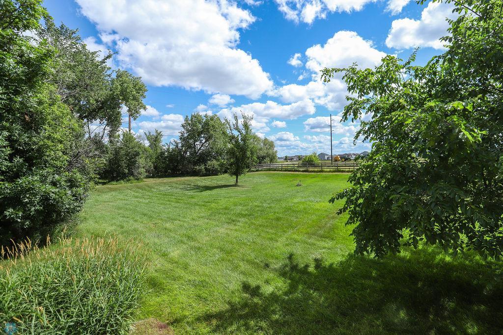 Side yard facing West Fargo, with fence