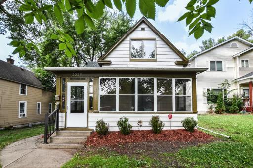 Welcome home to 3339 Aldrich! The front porch is a private porch for the lower level.