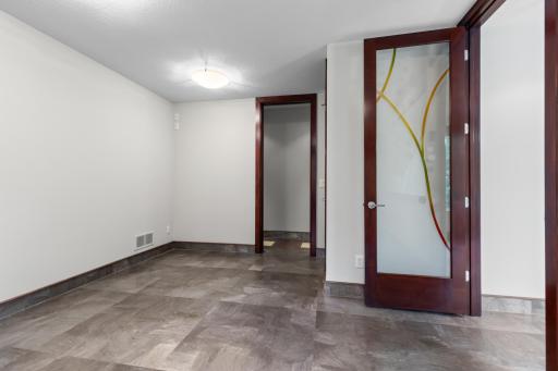 Exercise room and expansive living spaces for fitness, fun, and relaxation.