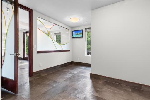 Exercise room and expansive living spaces for fitness, fun, and relaxation.