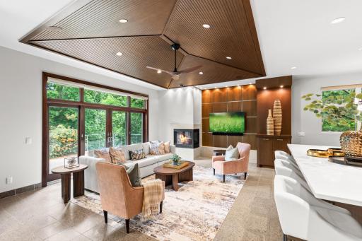 Just off of the kitchen - enjoy this beautifully designed sitting area with access to outdoor spaces