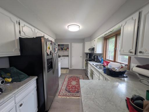 Bright and open kitchen with plenty of storage. Conveniently located next to the dining area for seamless mealtime flow.