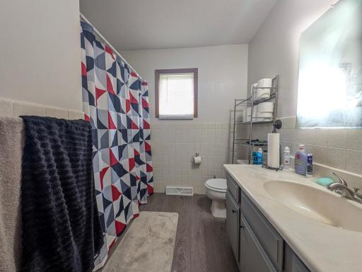 Clean and simple main bathroom with everything you need on one level. Functional layout for everyday convenience.