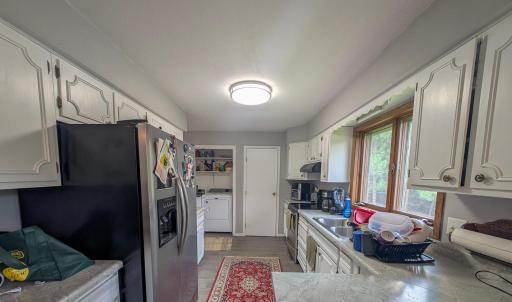 Bright and open kitchen with plenty of storage. Conveniently located next to the dining area for seamless mealtime flow.